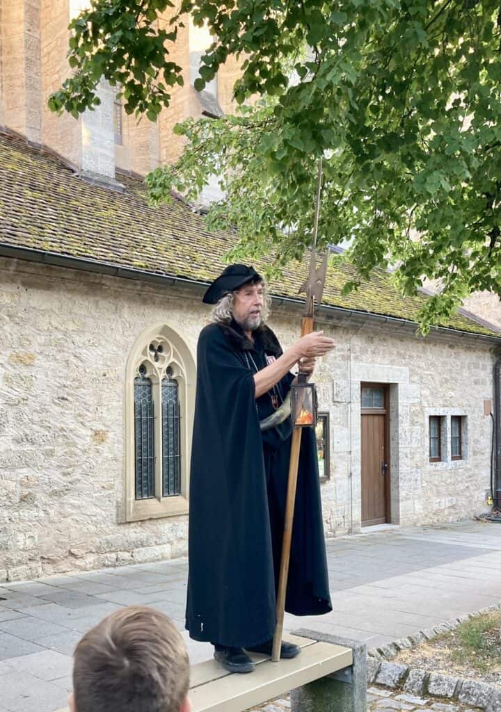 View of the Night Watchman of Rothenburg ob der Tauber, Germany