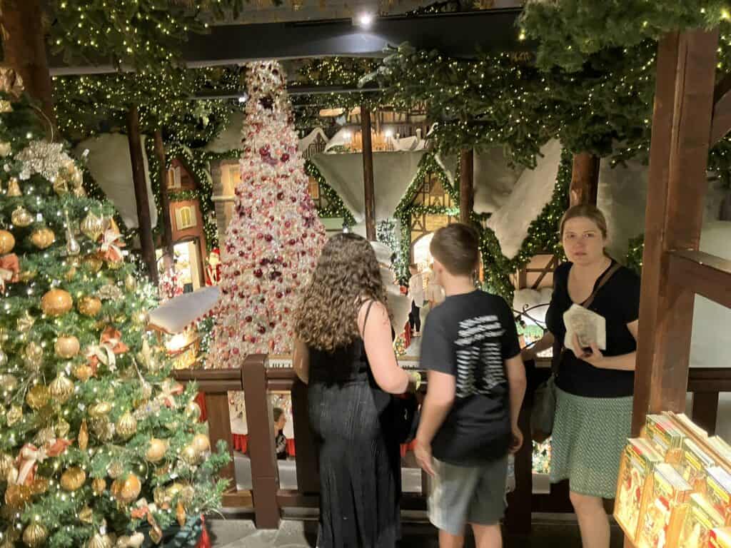 A woman and two teenagers in the Christmas store in Rothenburg ob der Tauber, Germany