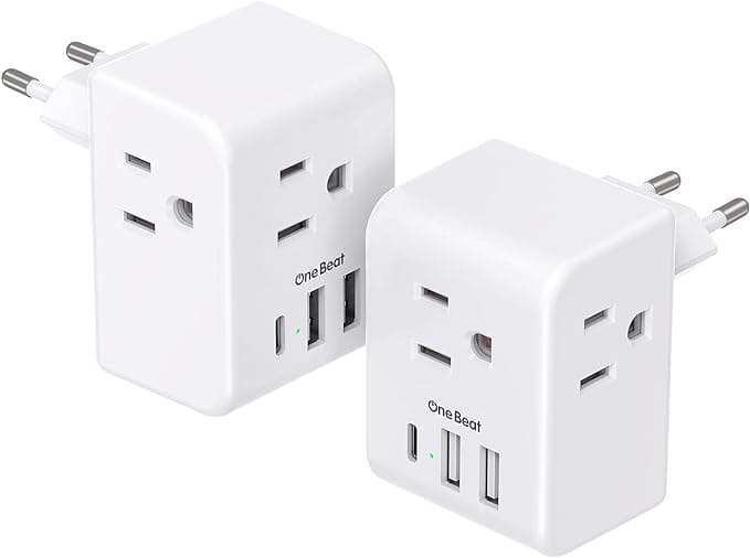 White plug adapters for European travel with American appliances