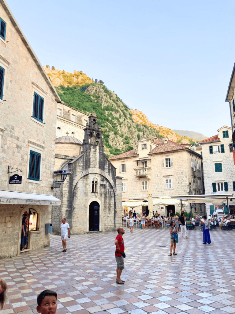 View of people standing in Greca Square in Kotor, Montenegro