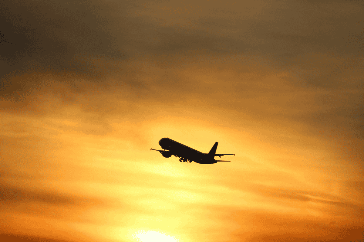 Plane in the sky with orange background