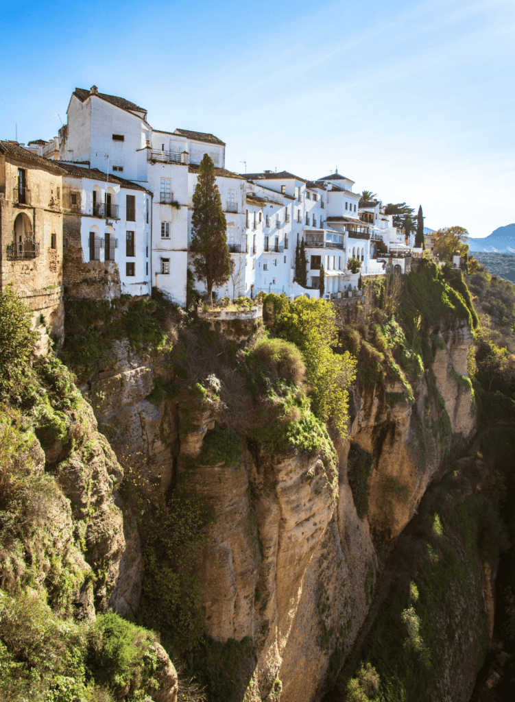 View of white buildings on the edge of the Tajo Gorge in Ronda, Spain