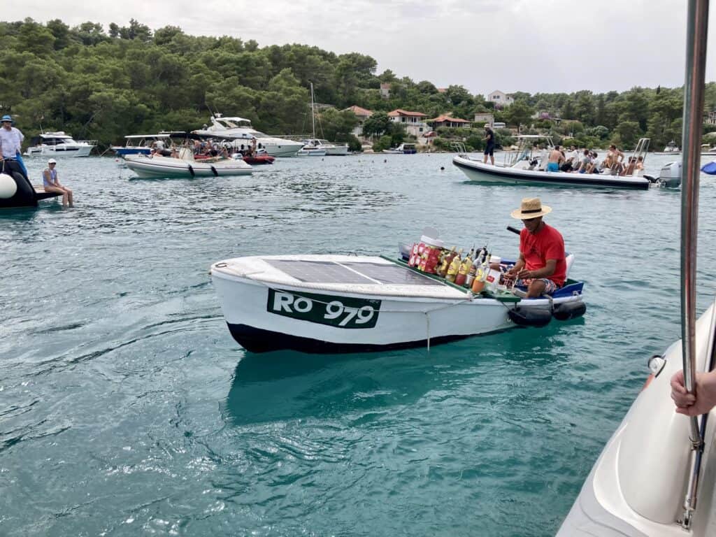 Man in a boat making drinks in Split, Croatia