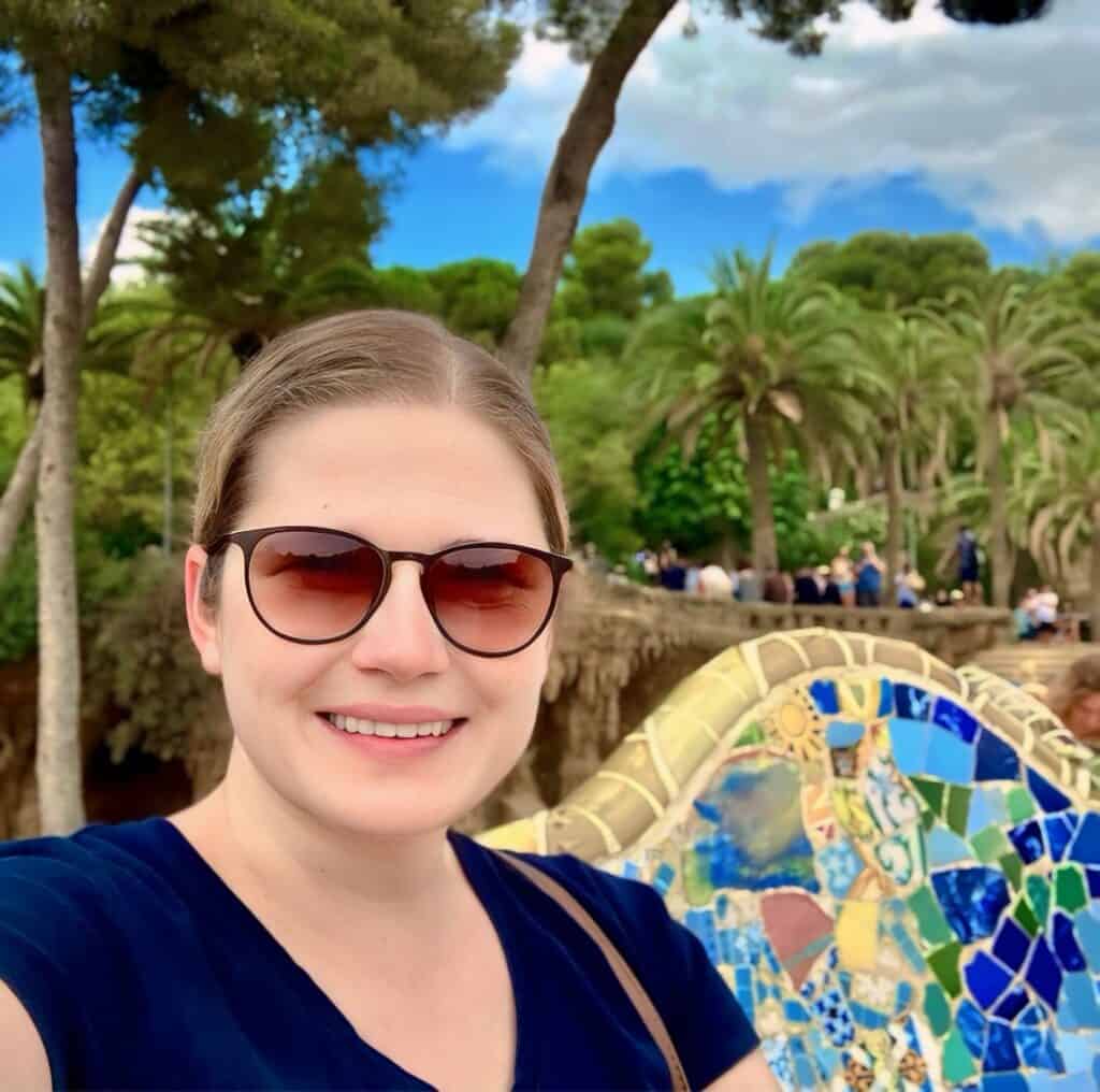 Woman sitting on bench at Park Guell