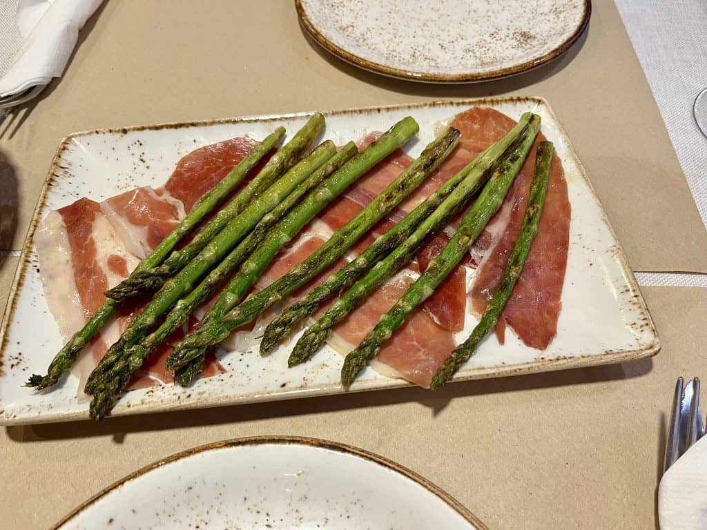 Grilled asparagus served over Spanish ham