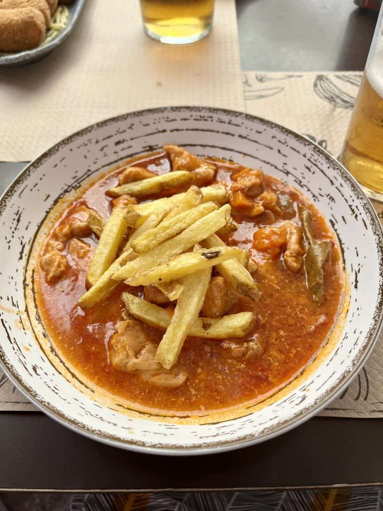 carcamusas stew with french fries on top in Toledo, Spain