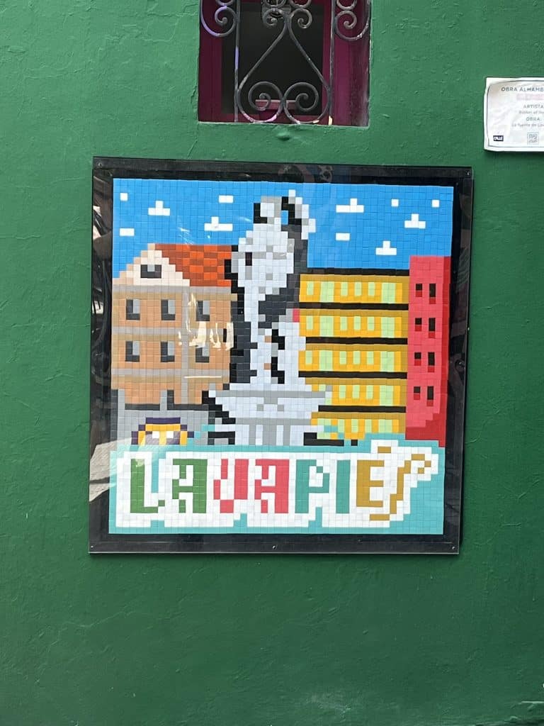 Street art tile that says Lavapies