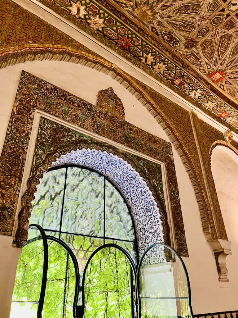 View of an open door and the surroundings at the Alcazar of Seville